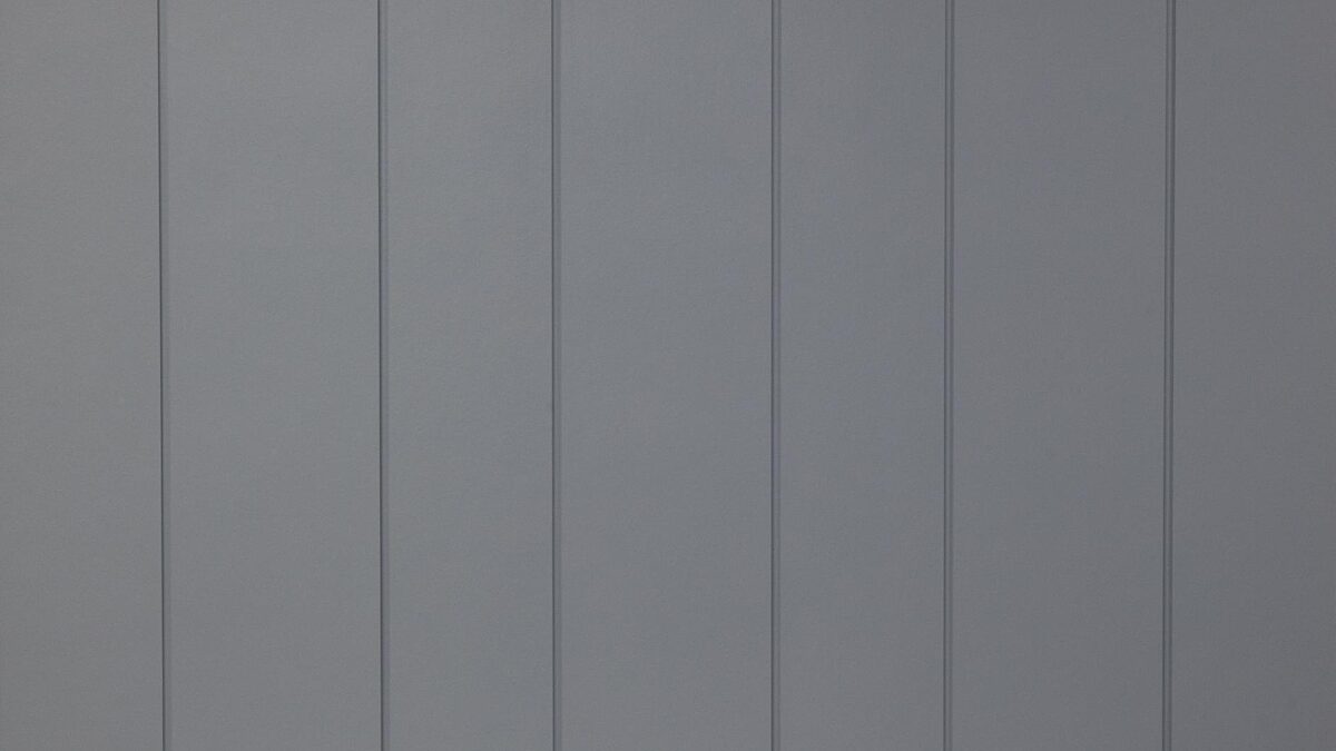 Close up of dark staggered vertical Stria™ Cladding